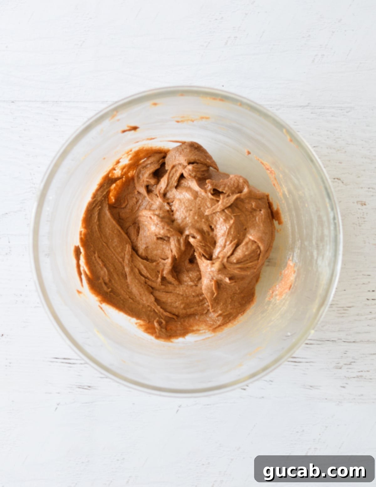 Smooth, glossy chocolate cookie dough after the egg has been fully incorporated.