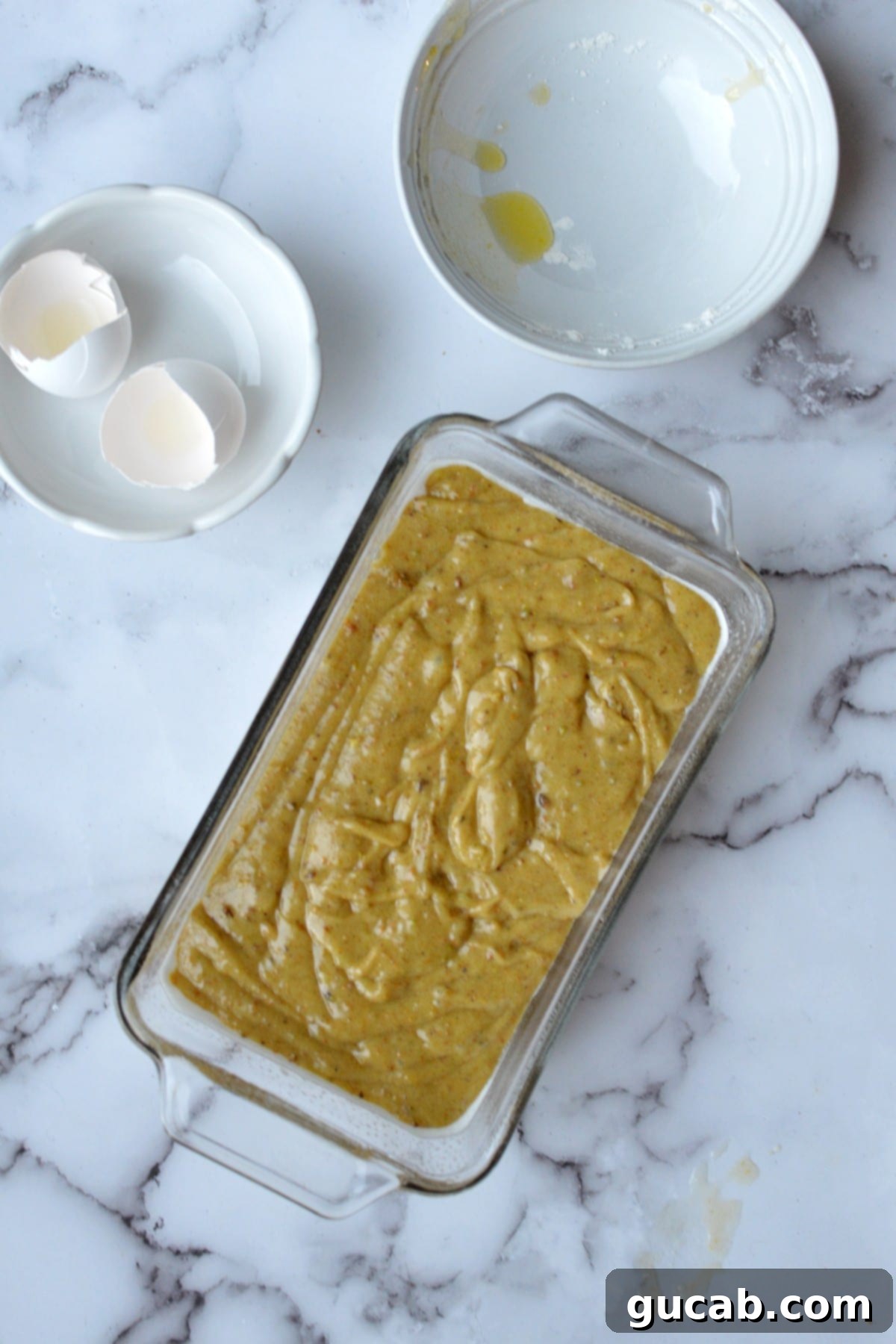 Exquisite Gluten-Free Pistachio Cake 7 Freshly baked golden-brown gluten-free pistachio cake in a loaf pan