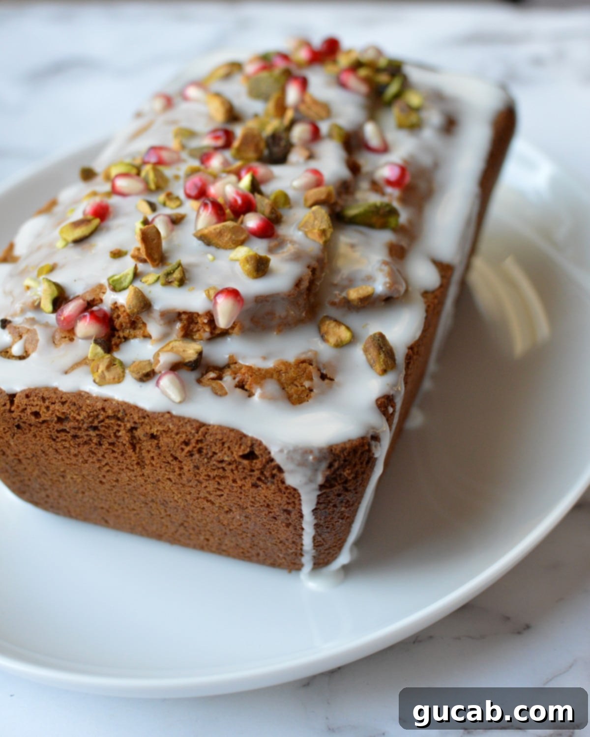 Exquisite Gluten-Free Pistachio Cake 8 Close-up of a slice of gluten-free pistachio cake with glaze and chopped pistachios