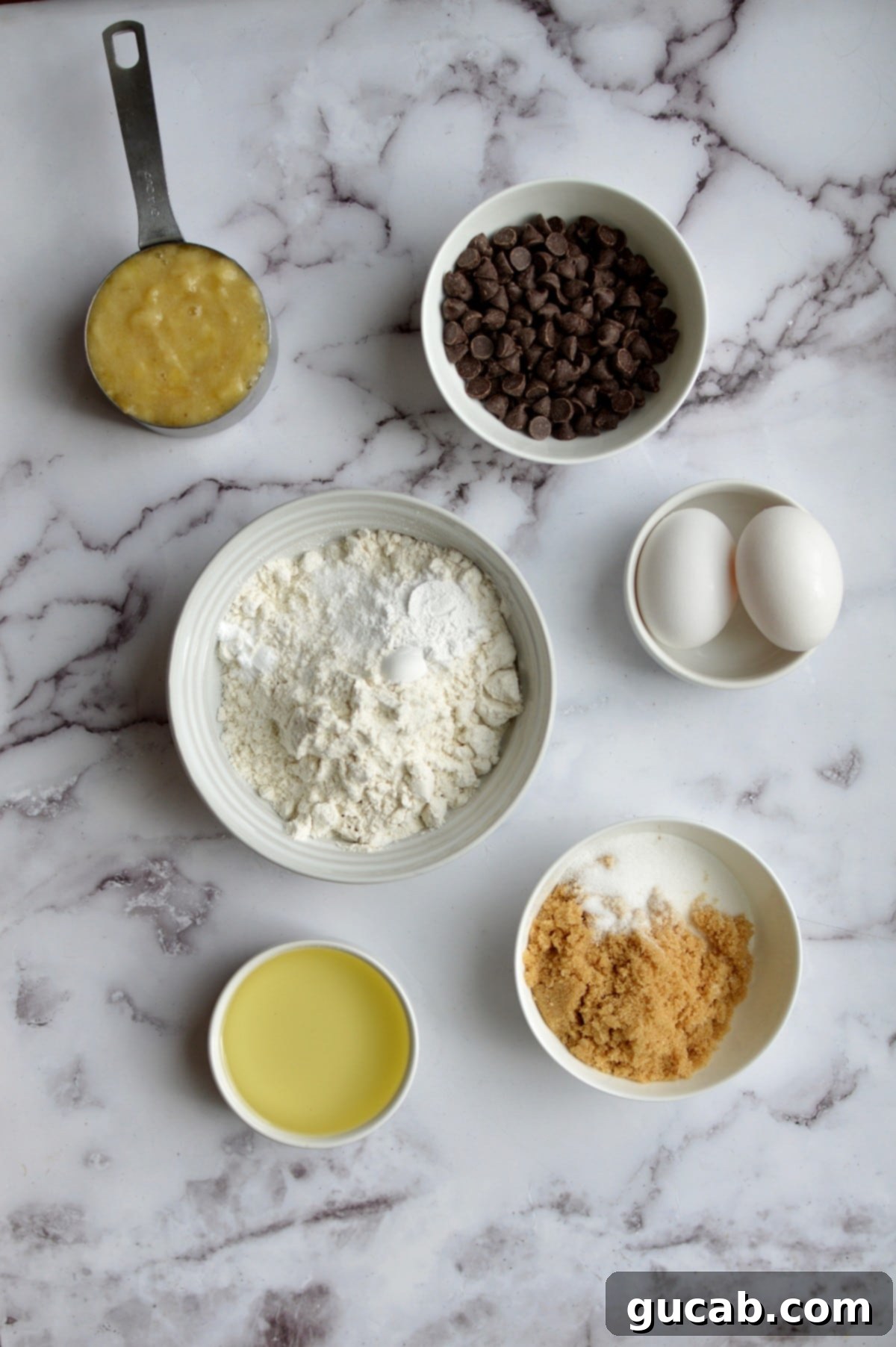 All ingredients laid out for making gluten-free banana chocolate chip muffins