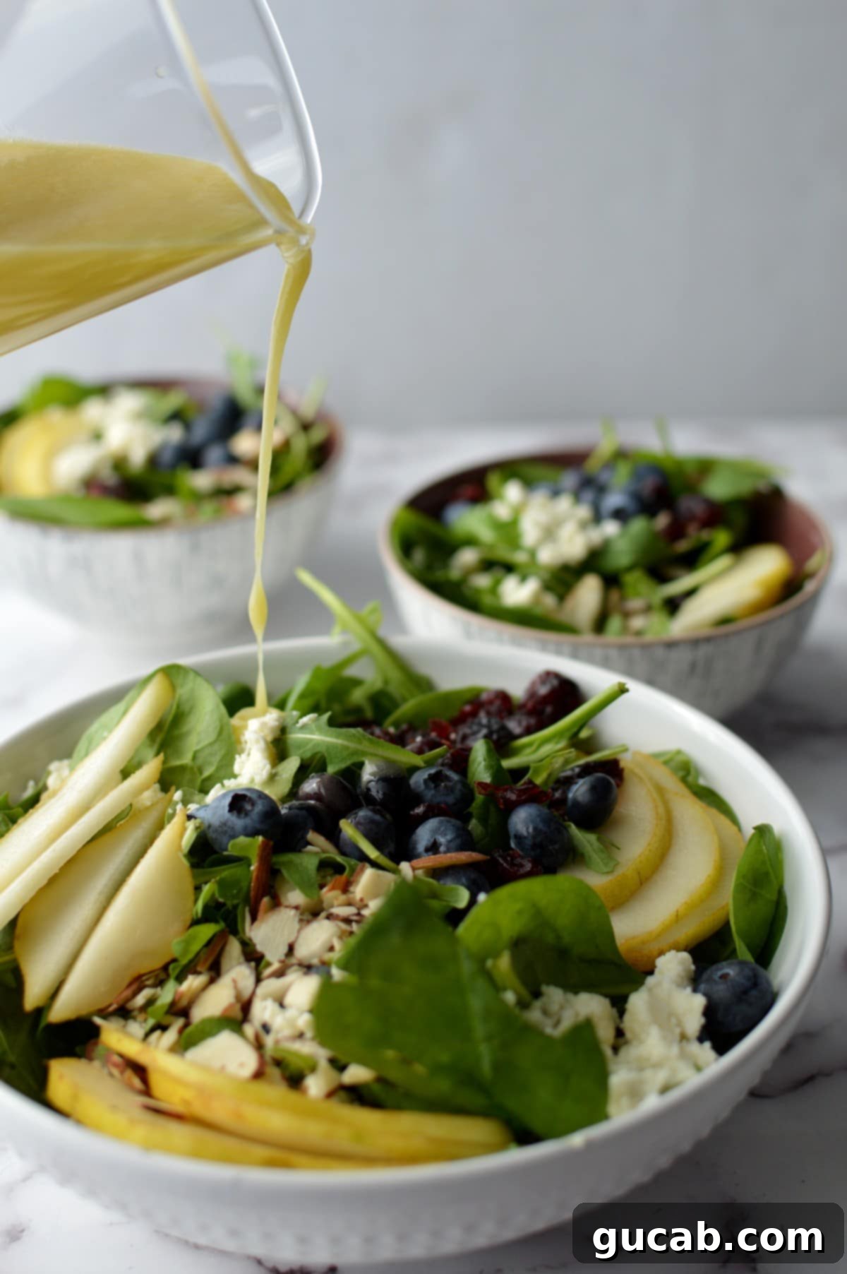 Sweet Pears and Peppery Greens with a Lemon Zest 2 spinach arugula salad with blueberries and almonds