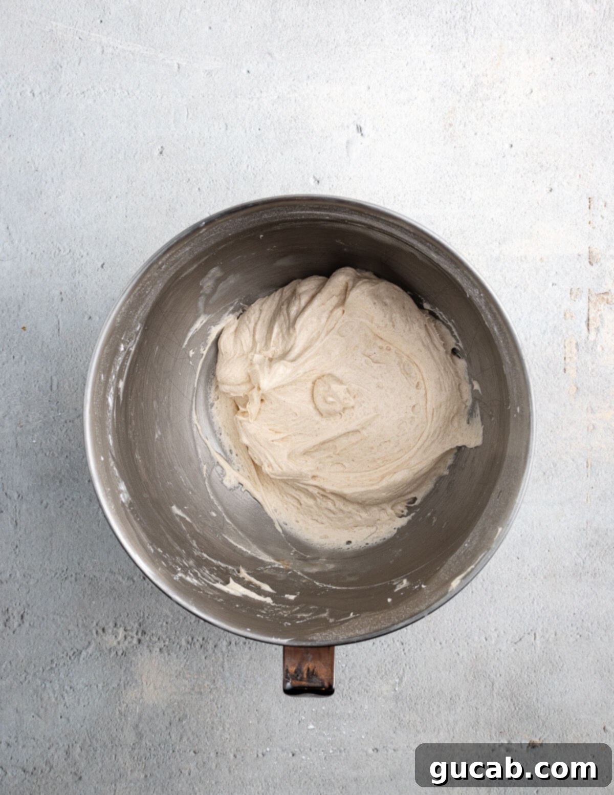 Golden Pumpkin Bliss: Gluten-Free Maple-Cinnamon Cupcakes 14 A mixing bowl filled with smooth, fluffy maple buttercream, perfectly piped and ready to frost cupcakes.