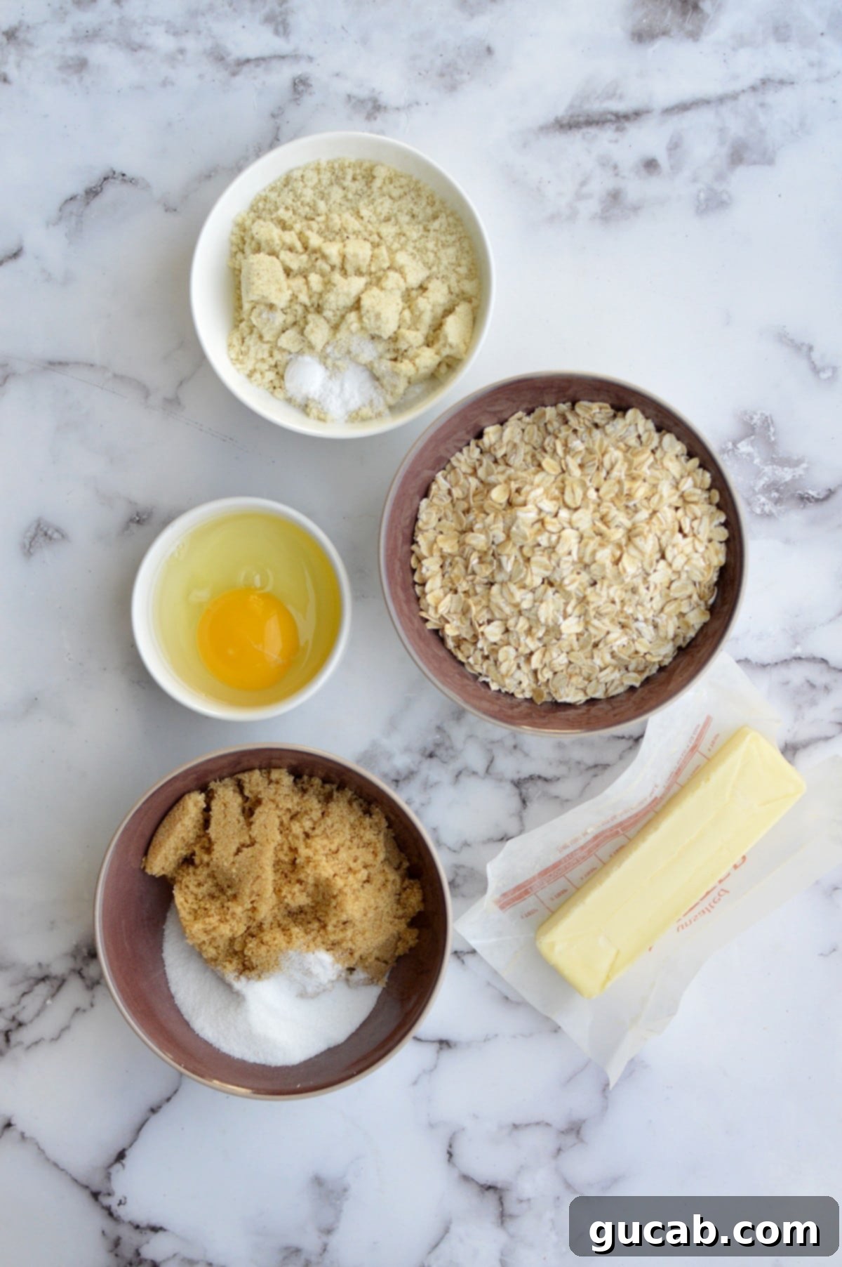 Ingredients for almond flour oatmeal cookies laid out on a table