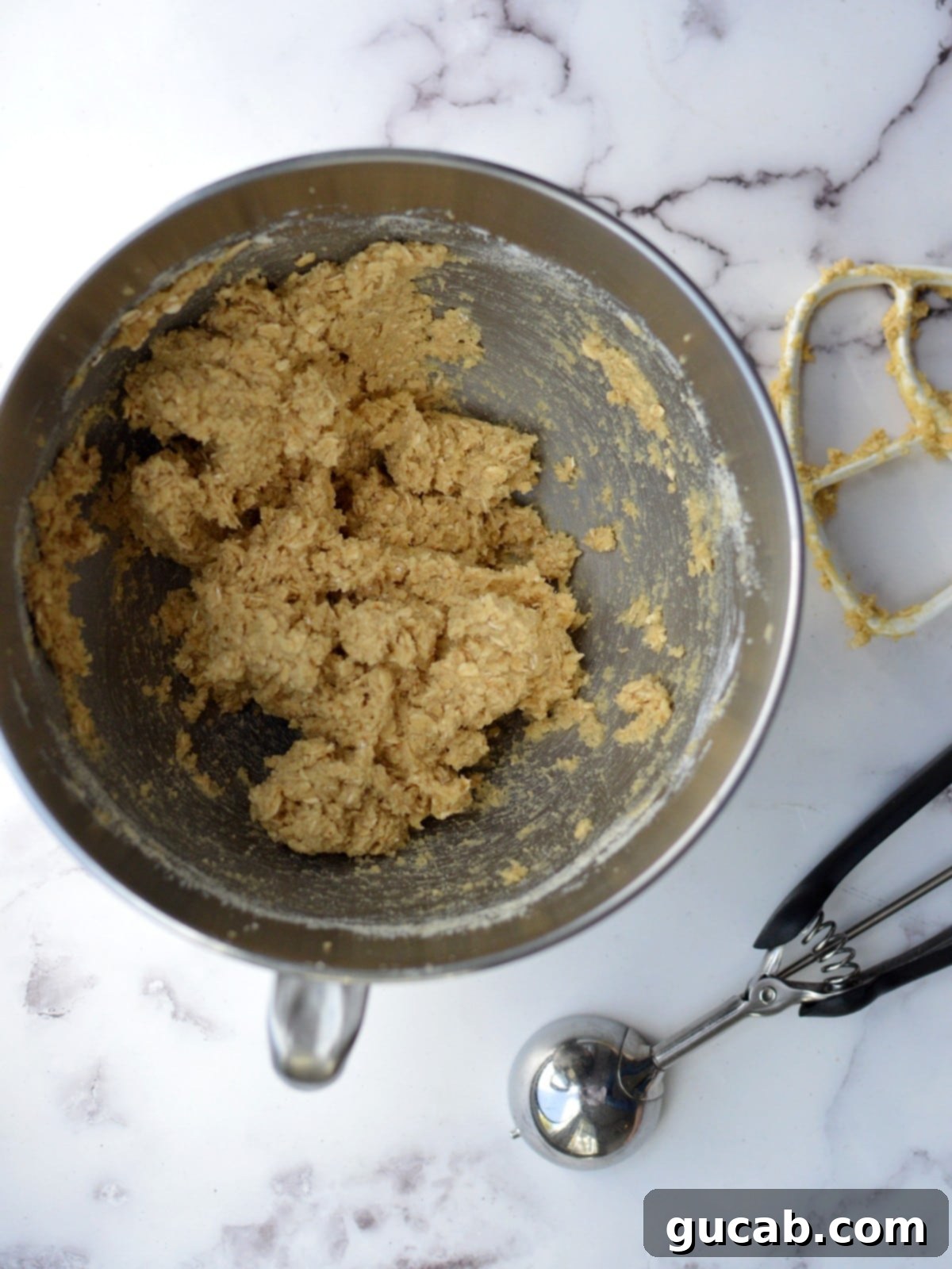 A bowl of almond flour oatmeal cookie dough, ready to be scooped