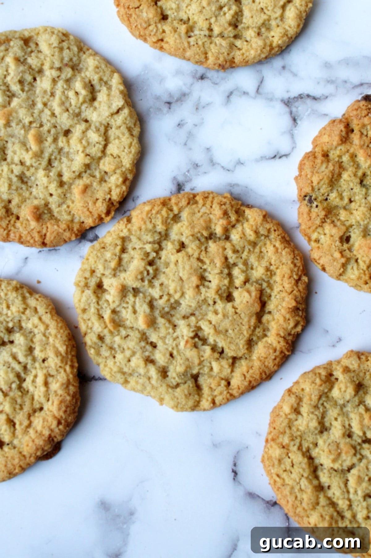 Freshly baked almond flour oatmeal cookies on a cooling rack