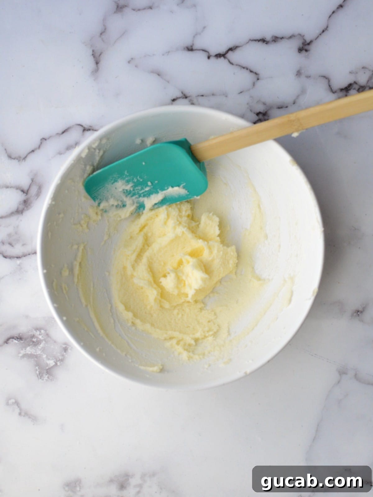 A bowl of creamed butter and sugar, light and fluffy
