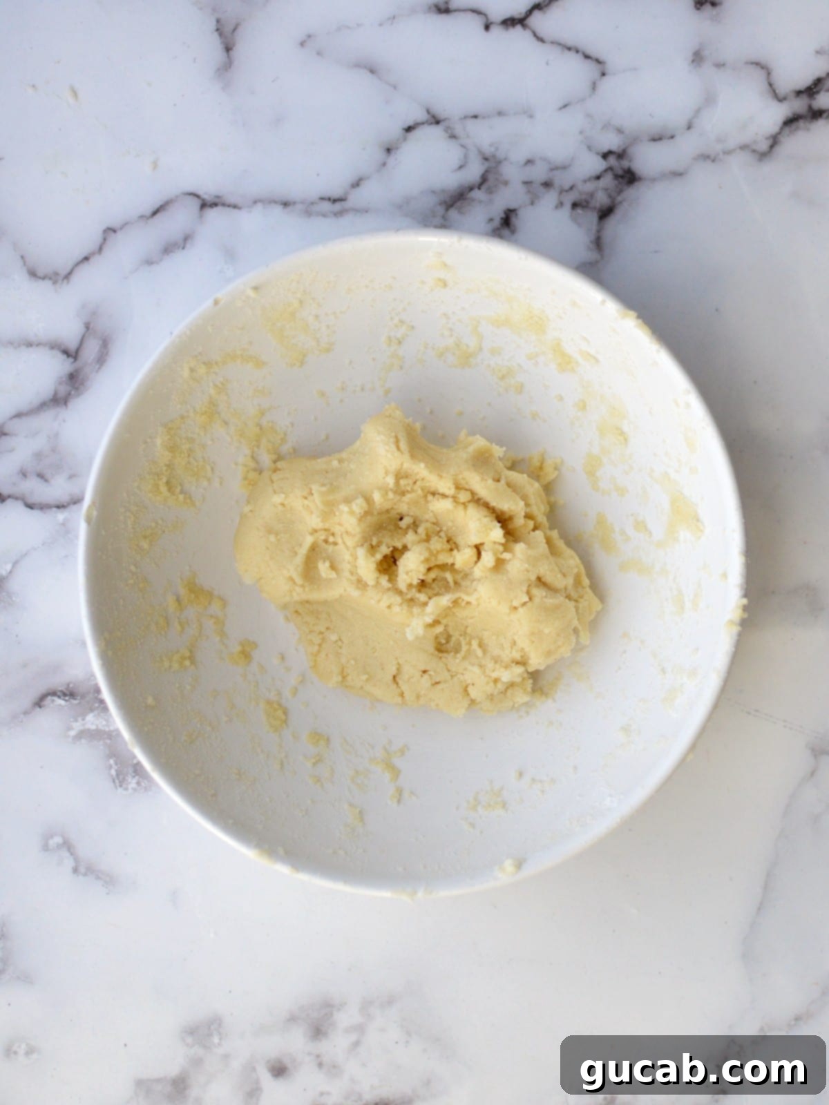 Buttery Almond Flour Shortbread 5 Almond flour shortbread cookie dough in a mixing bowl