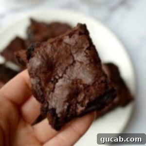 Almond Flour Brownie with a fudgy center and crackled top.