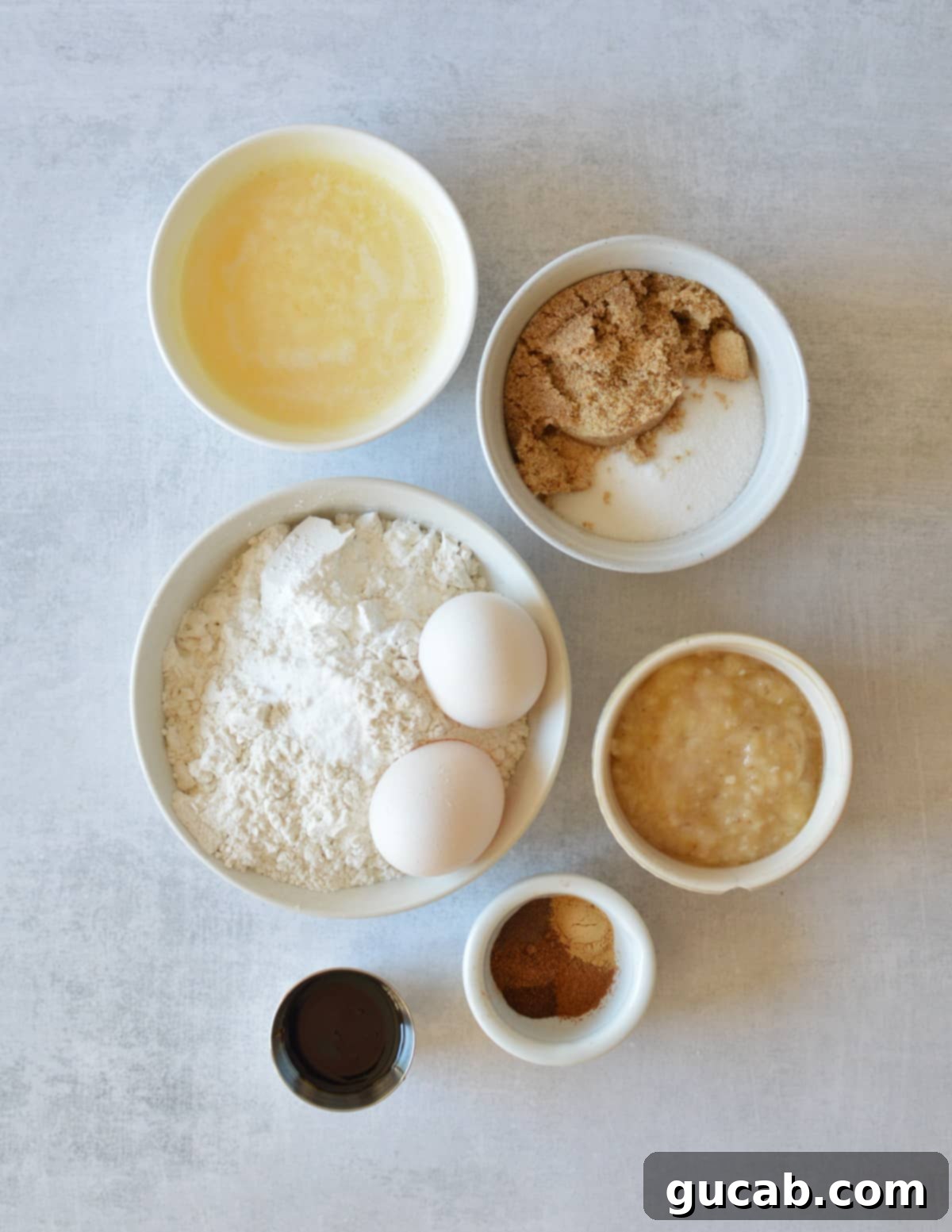 melted butter, sugar, brown sugar, gluten-free flour, baking powder, baking soda, eggs, mashed banana, molasses, and spices.