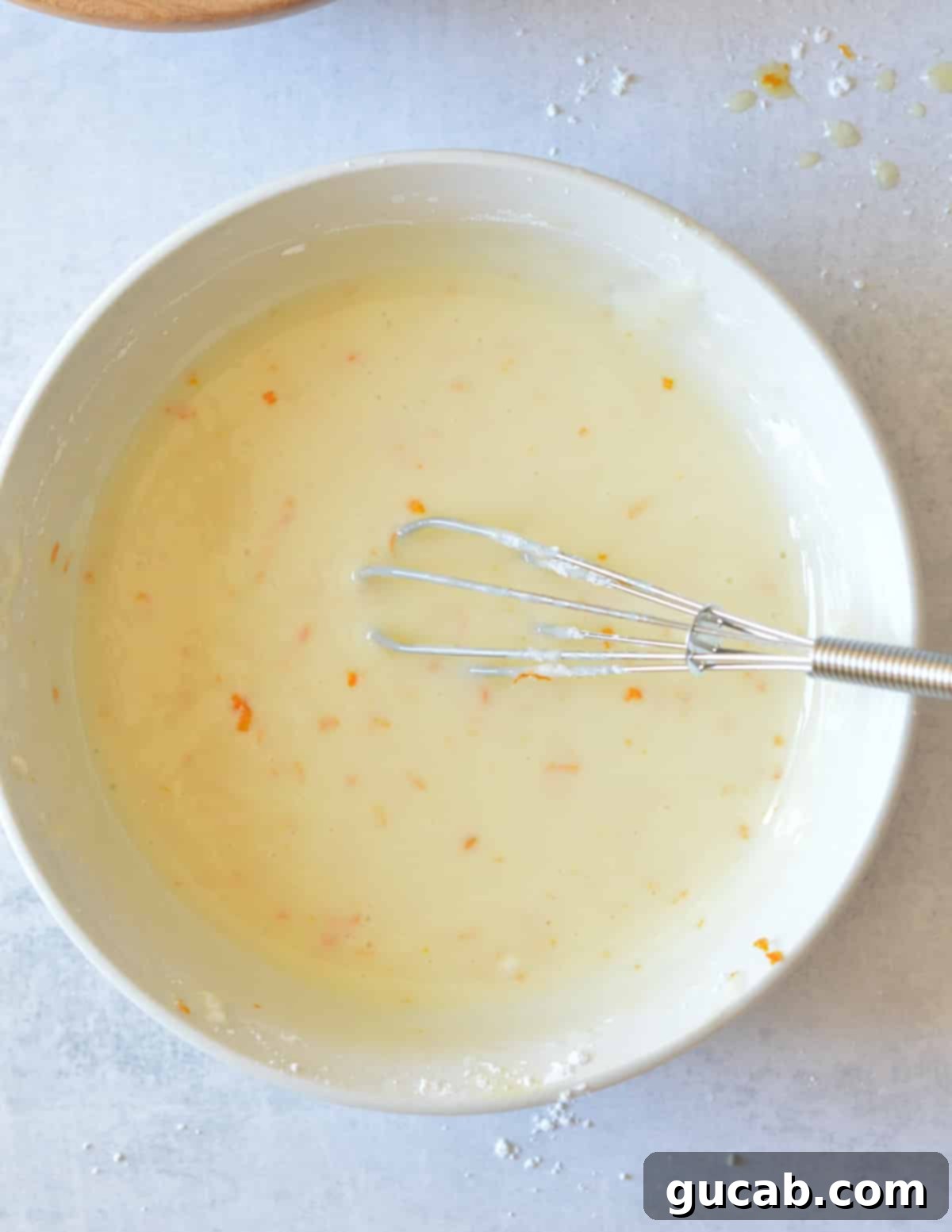 a bowl of orange glaze