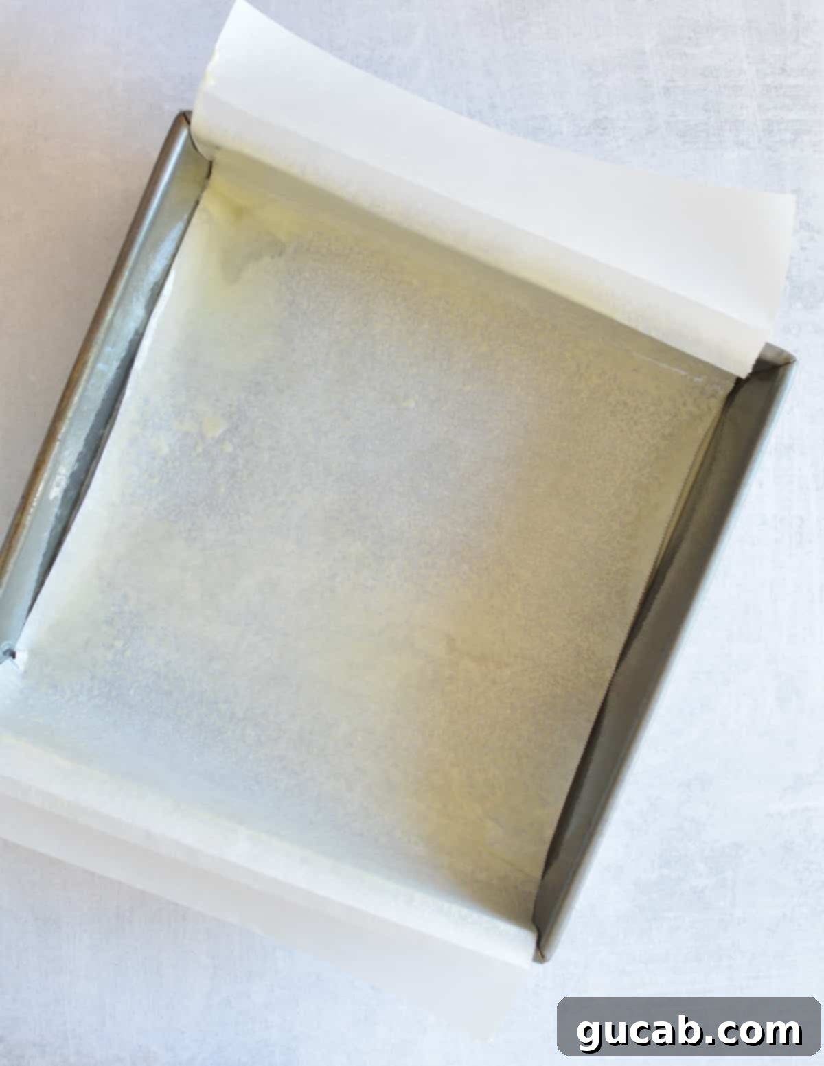 parchment paper in a baking pan coated in nonstick spray.