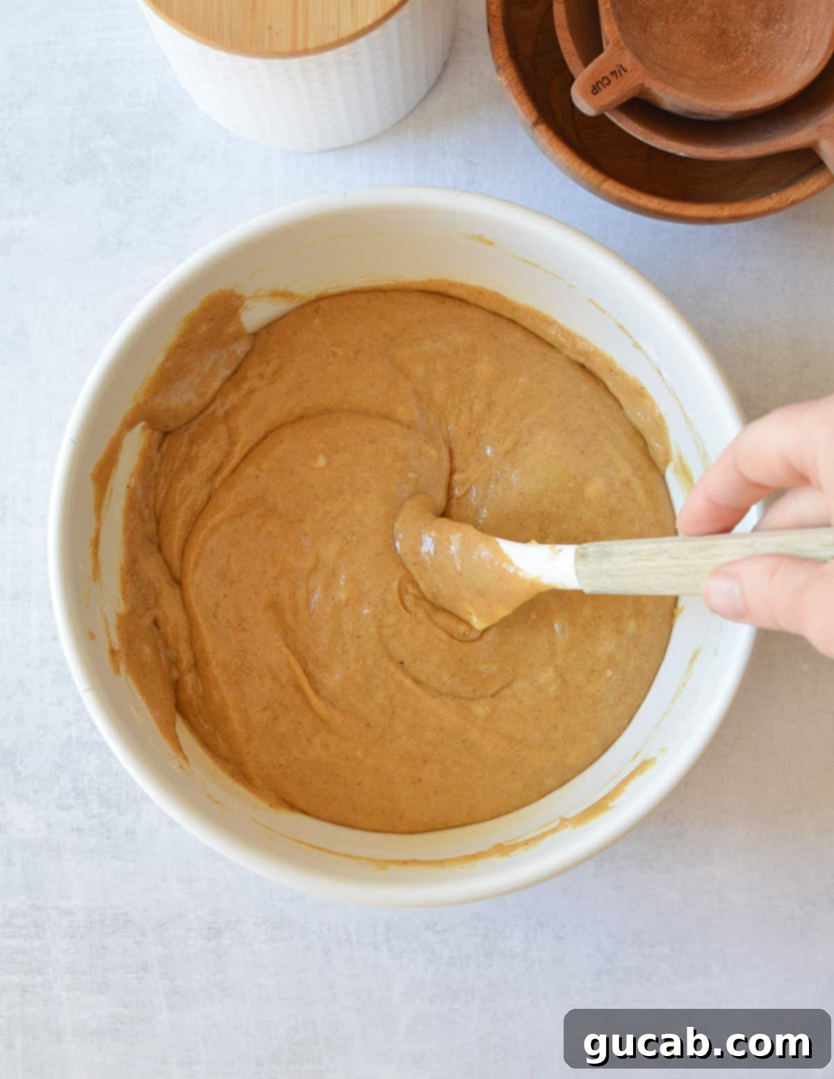 a bowl of gluten free gingerbread cake batter