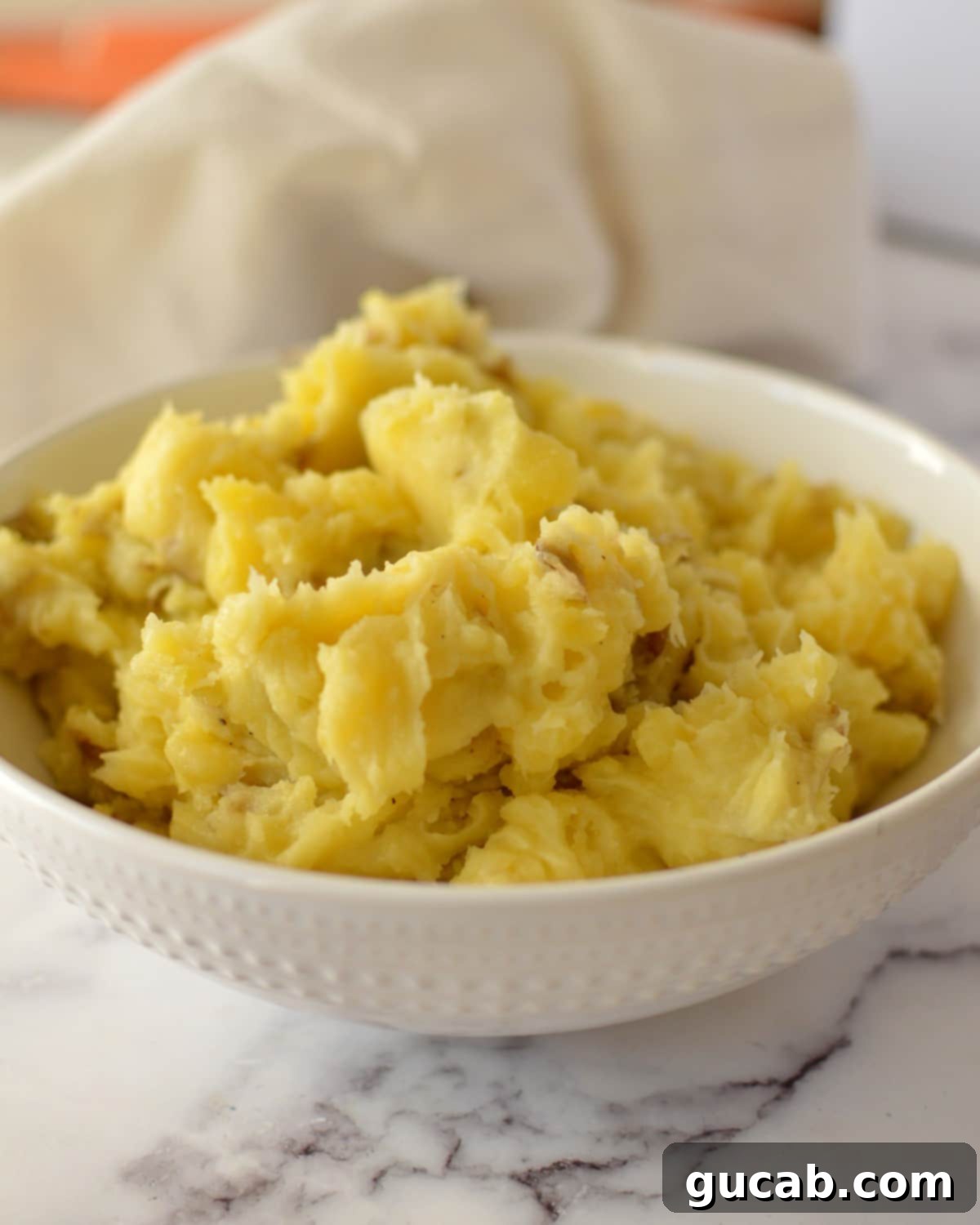 Creamy Almond Mashed Potatoes 2 dairy-free mashed potatoes in a bowl