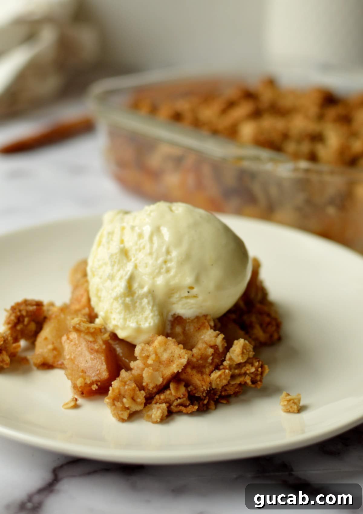 Wholesome Apple Crumble 2 healthy apple crisp with vanilla ice cream on top