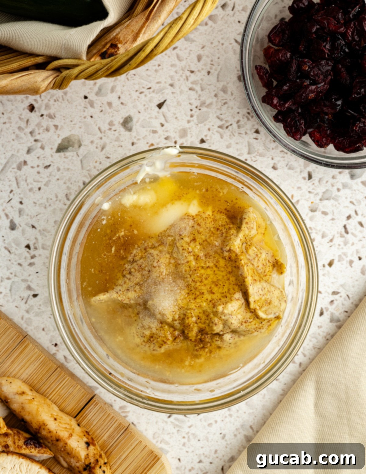 a bowl with mayo, mustard, honey, lemon juice, and salt in it. 