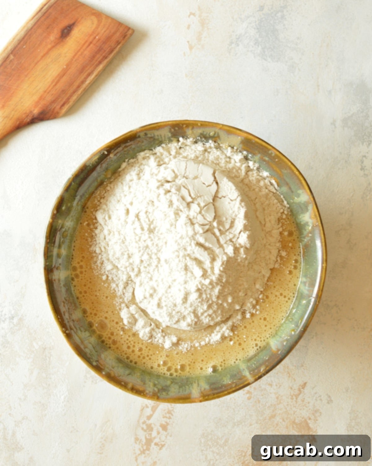 Golden Gluten and Dairy-Free Yellow Cake 6 cake batter with flour on top