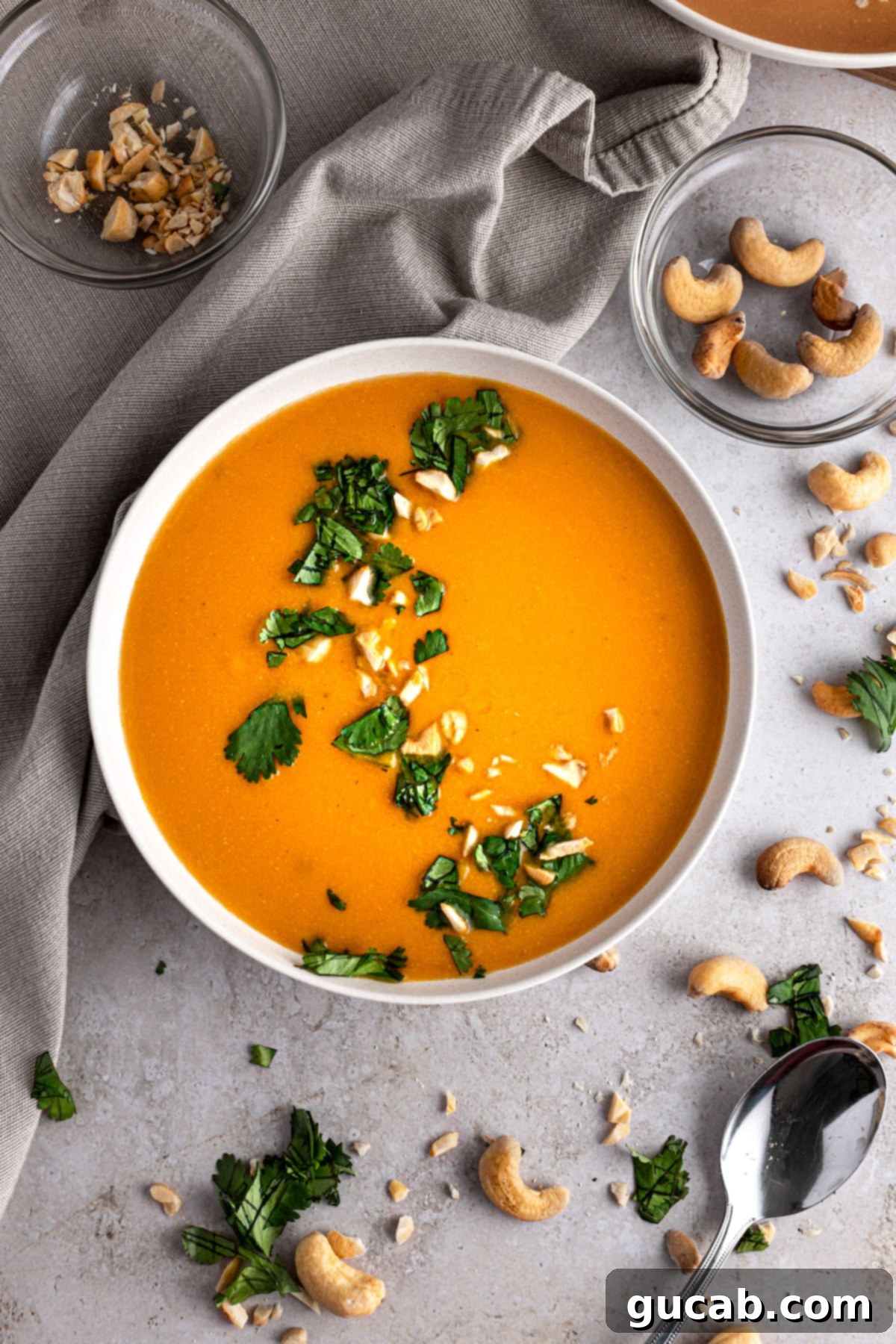 a bowl of carrot ginger soup, a creamy and flavorful gluten-free, dairy-free meal