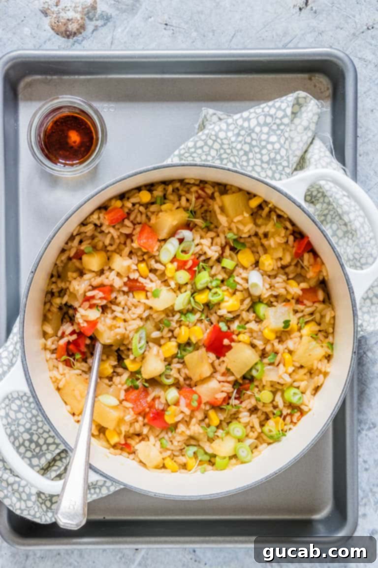 pineapple fried rice in a large pot, a flavorful gluten-free, dairy-free, egg-free meal