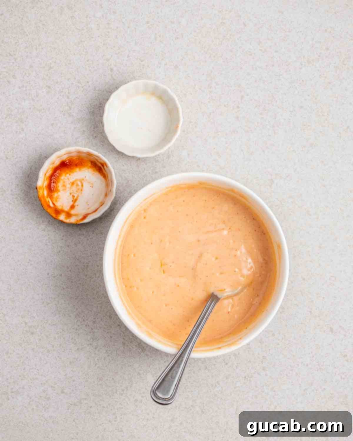 a ramekin of vegan siracha mayo