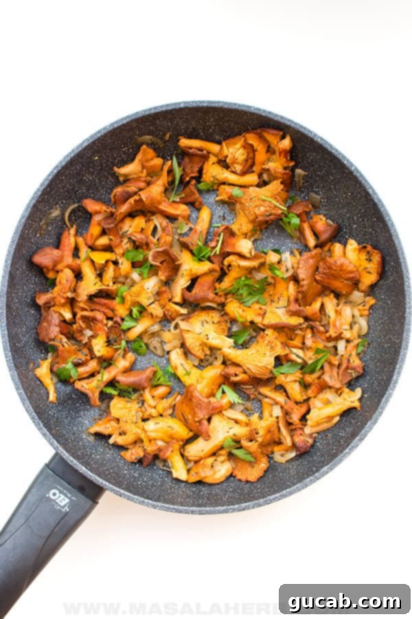 a saute pan with chanterelle mushrooms in it