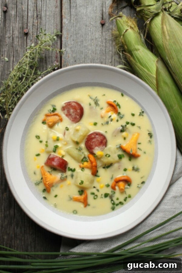 a bowl of corn chowder with sausage and mushrooms
