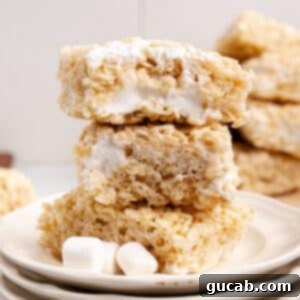 A stack of golden, gooey coconut oil rice crispy treats, ready to be enjoyed.