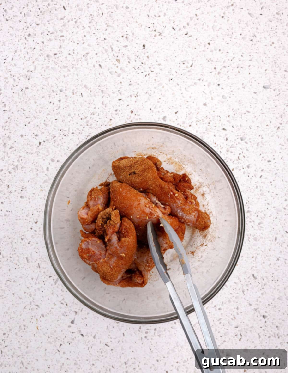 Perfectly Baked Boneless Skinless Chicken Thighs 6 a bowl of seasoned chicken thighs