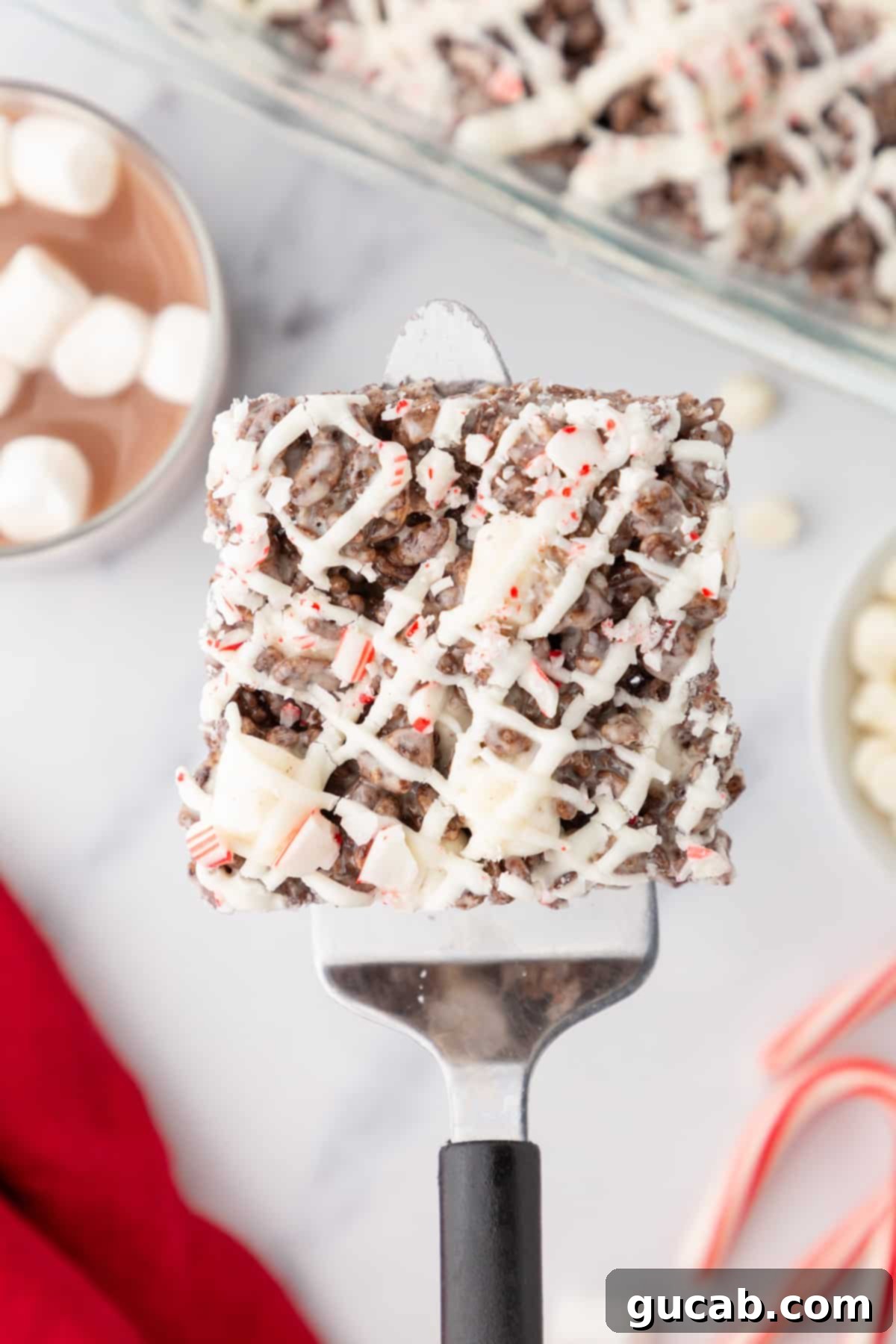 Peppermint bark Rice Krispie treat on a spatula