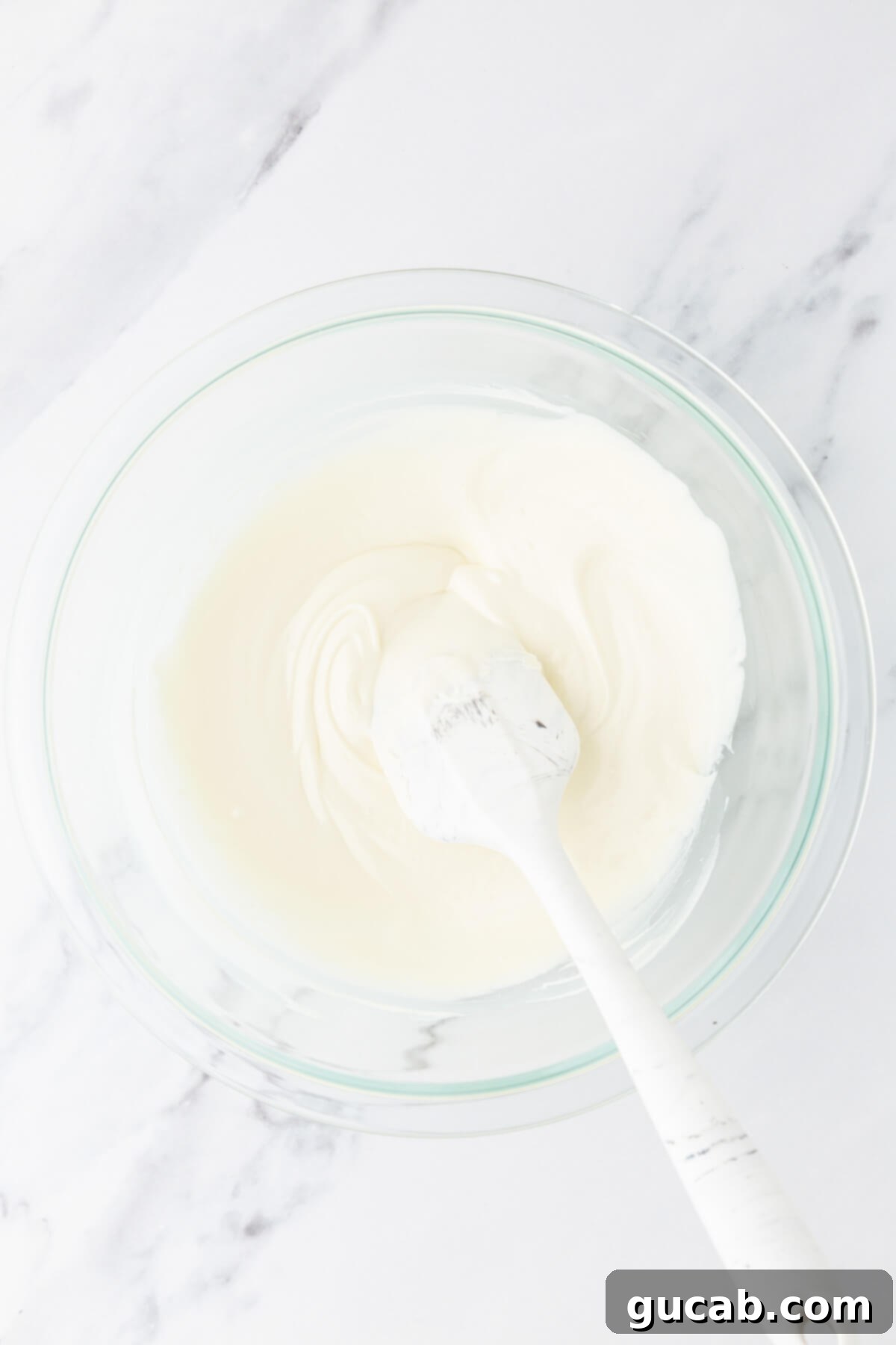 Melted white chocolate in a bowl