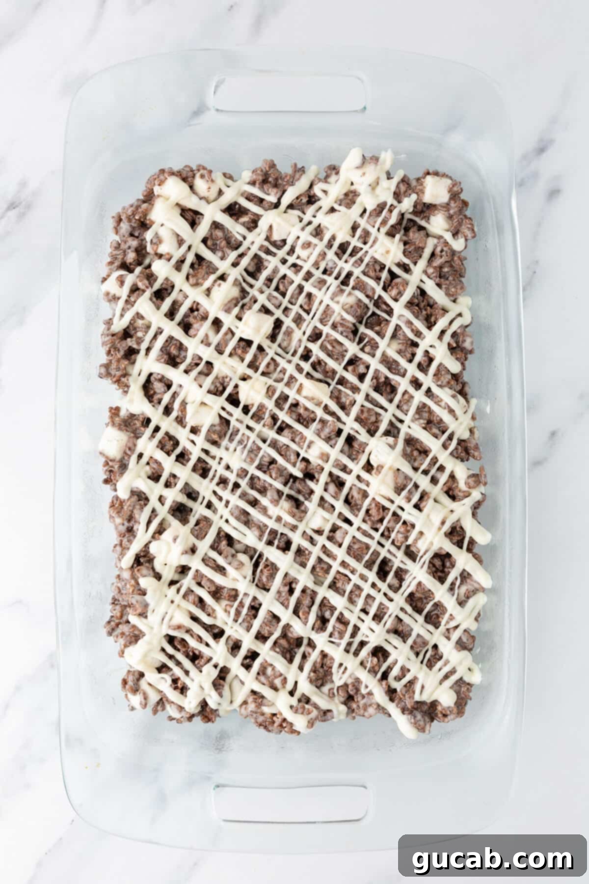 White chocolate drizzled over Rice Krispie treats