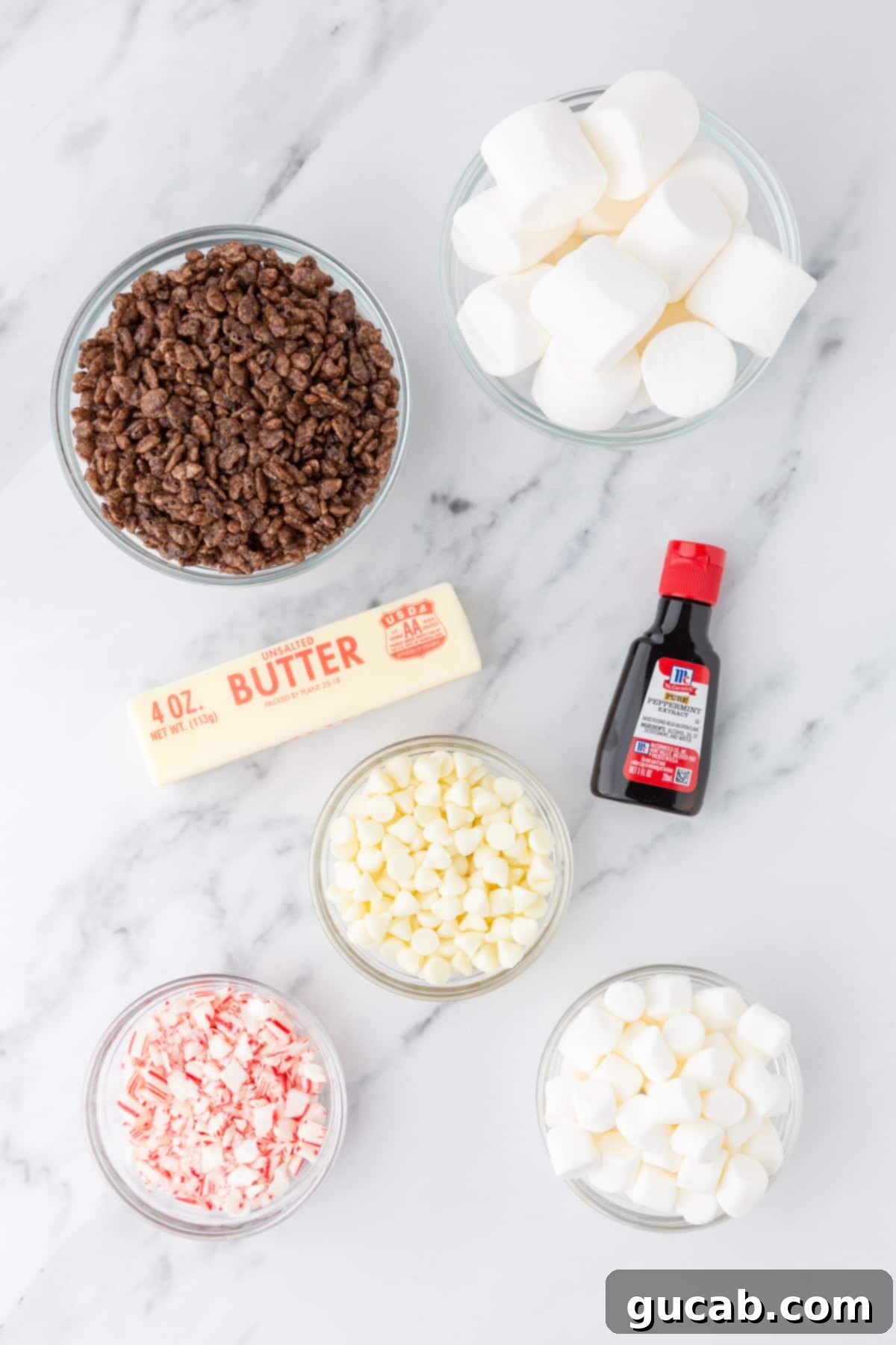 Cocoa Krispies, marshmallows, butter, peppermint extract, white chocolate, candy canes, mini marshmallows