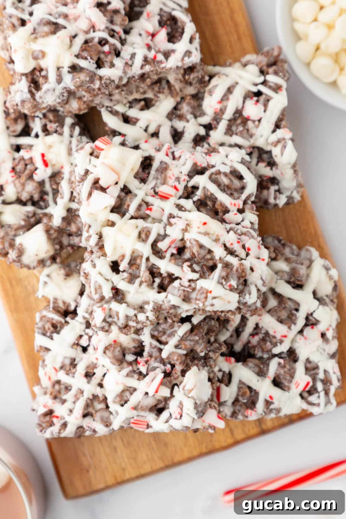 Peppermint bark Rice Krispie treats on a cutting board