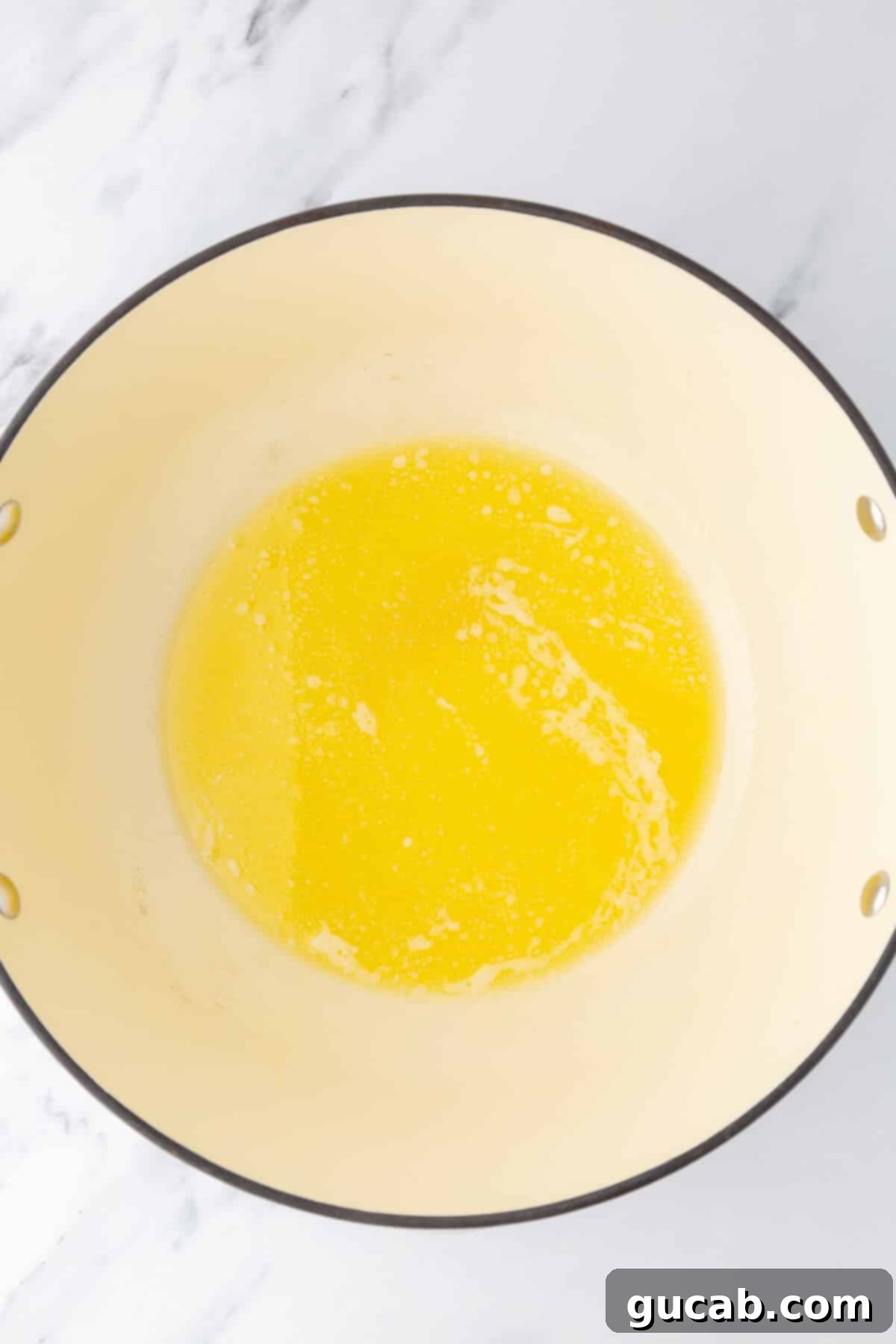 Melted butter in a Dutch oven
