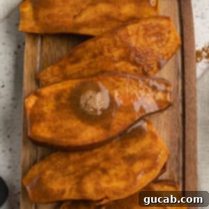 Baked sweet potatoes with maple butter on top, showcasing a final image.