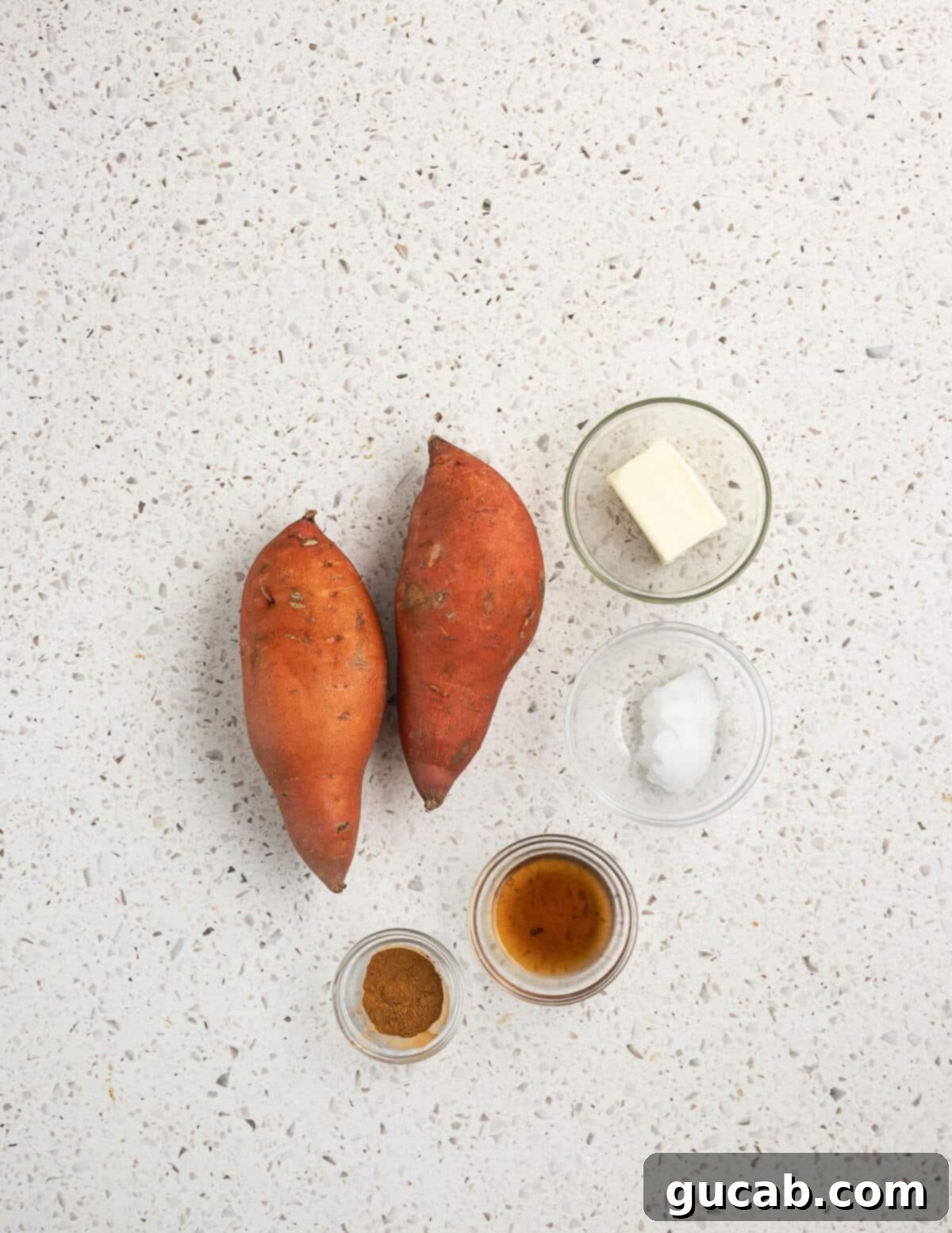Close-up of the key ingredients: fresh sweet potatoes, creamy butter, coconut oil, pure maple syrup, and fragrant cinnamon.