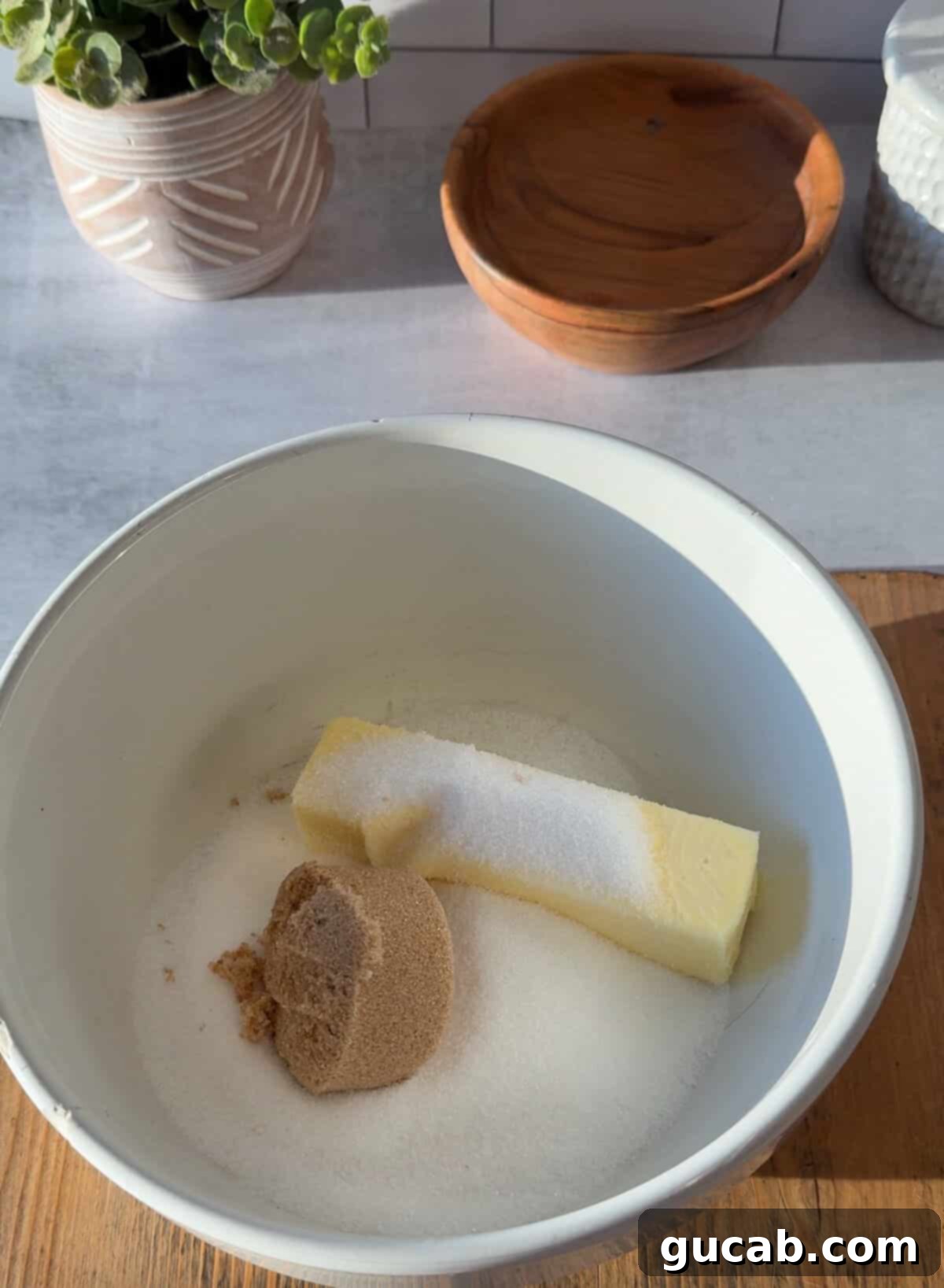 Oat Flour Double Chocolate Chunk Cookies 3 A close-up shot of butter, sugar, and brown sugar being creamed together in a mixing bowl.