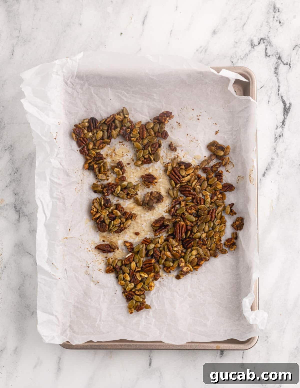 Pomegranate Pear Salad with Candied Pumpkin Seeds 6 Candied pepitas and pecans after baking.