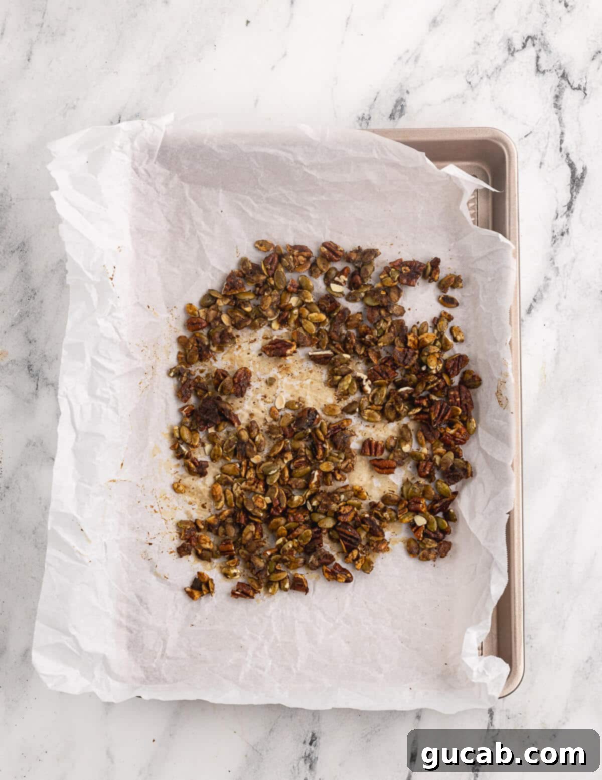 Pomegranate Pear Salad with Candied Pumpkin Seeds 7 Candied pepitas cooling on a sheet pan.