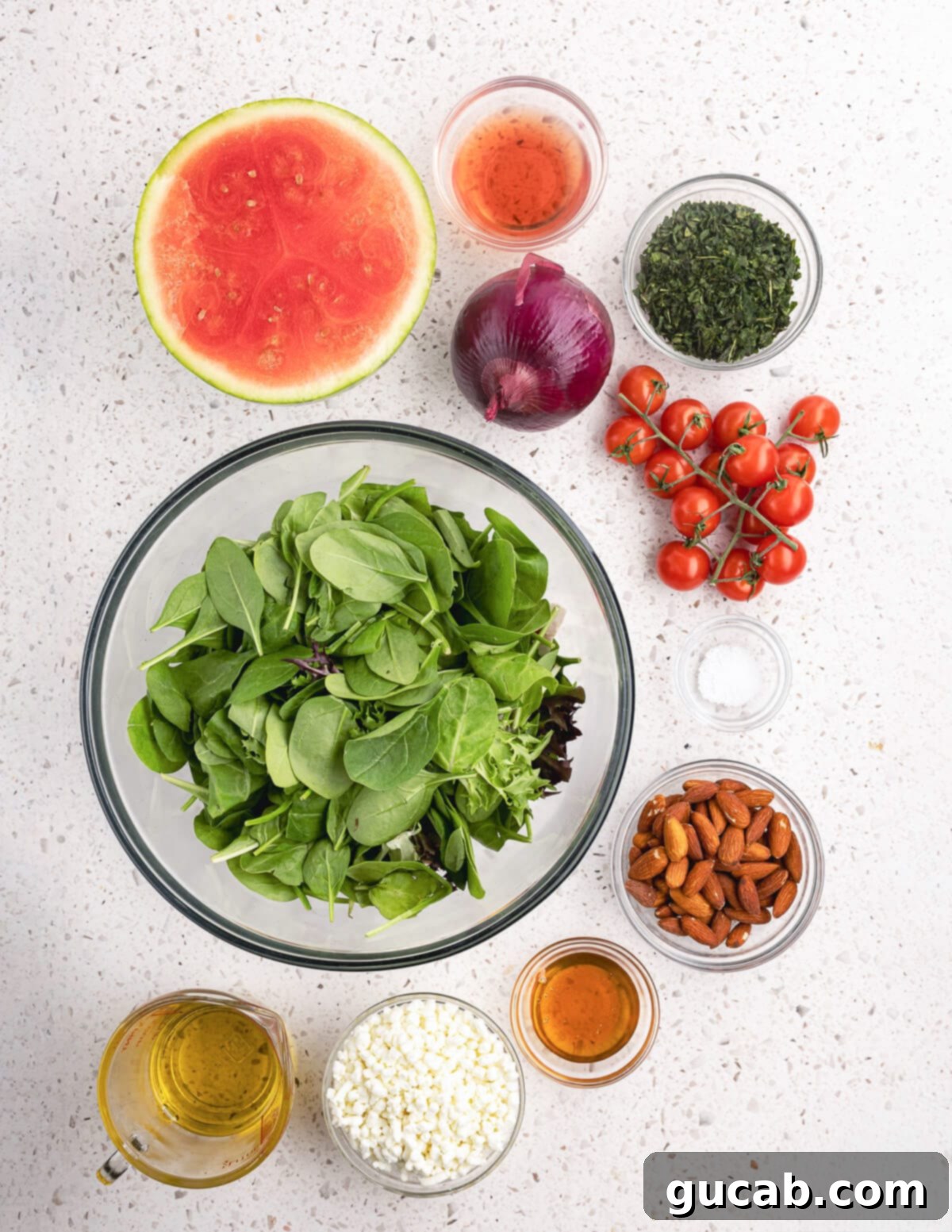 Close-up of the key ingredients for watermelon salad, highlighting the fresh produce and almonds.