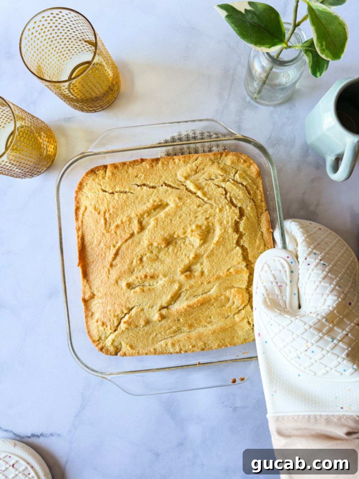 Golden gluten-free cornbread, baked to perfection in a square baking dish.