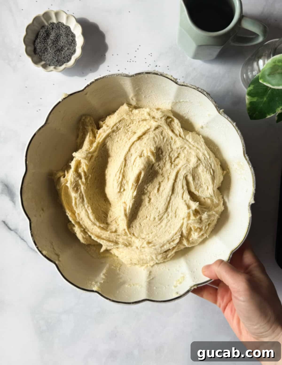 Lemon Poppyseed Bliss: A Gluten-Free Delight 11 A bowl of gluten-free cake batter, showing a thick and smooth consistency.