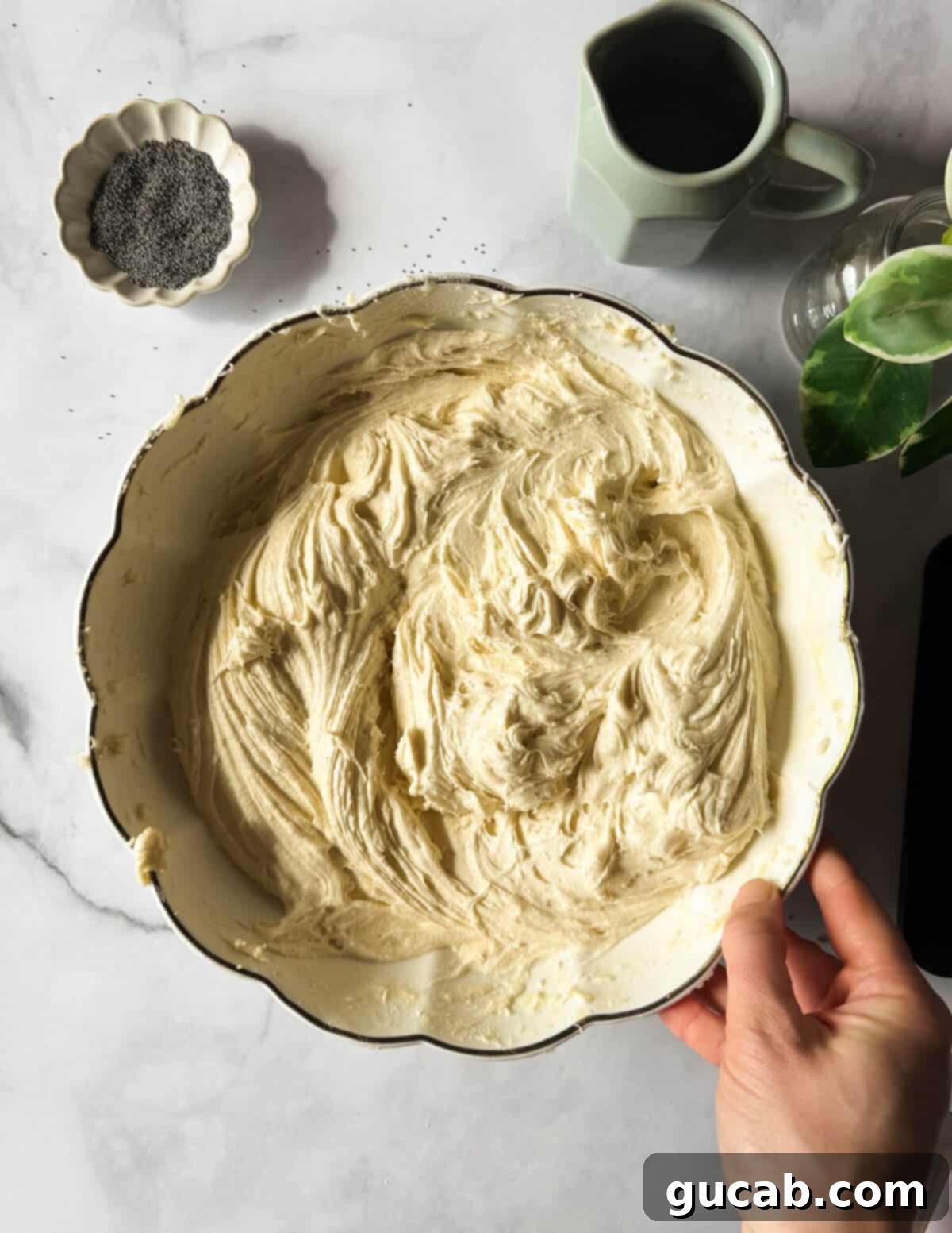 Lemon Poppyseed Bliss: A Gluten-Free Delight 13 A bowl of gluten-free cake batter, showing a smooth and even consistency after adding the wet ingredients.