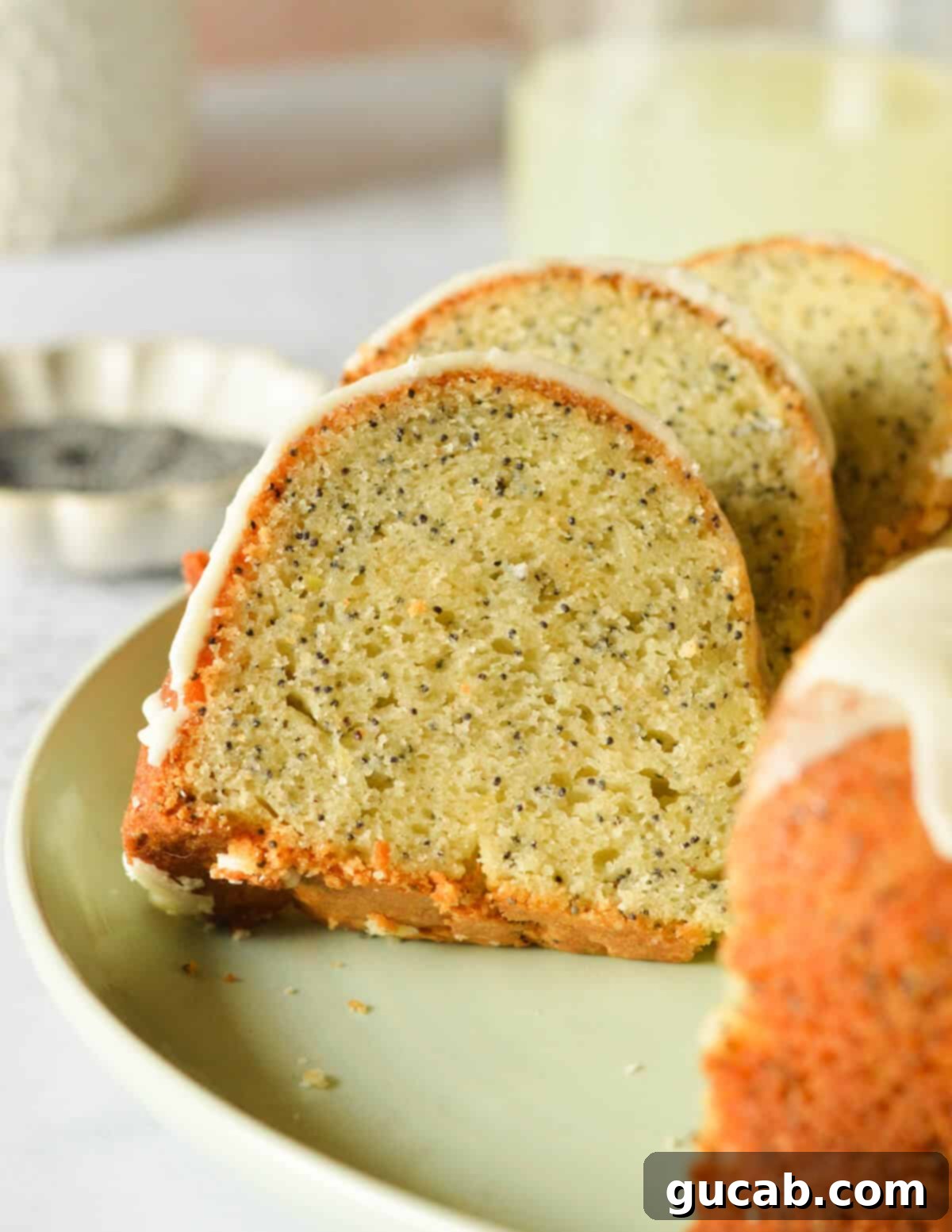 Lemon Poppyseed Bliss: A Gluten-Free Delight 17 A close-up of a slice of gluten-free lemon poppyseed cake, showcasing its moist texture and delicious glaze.