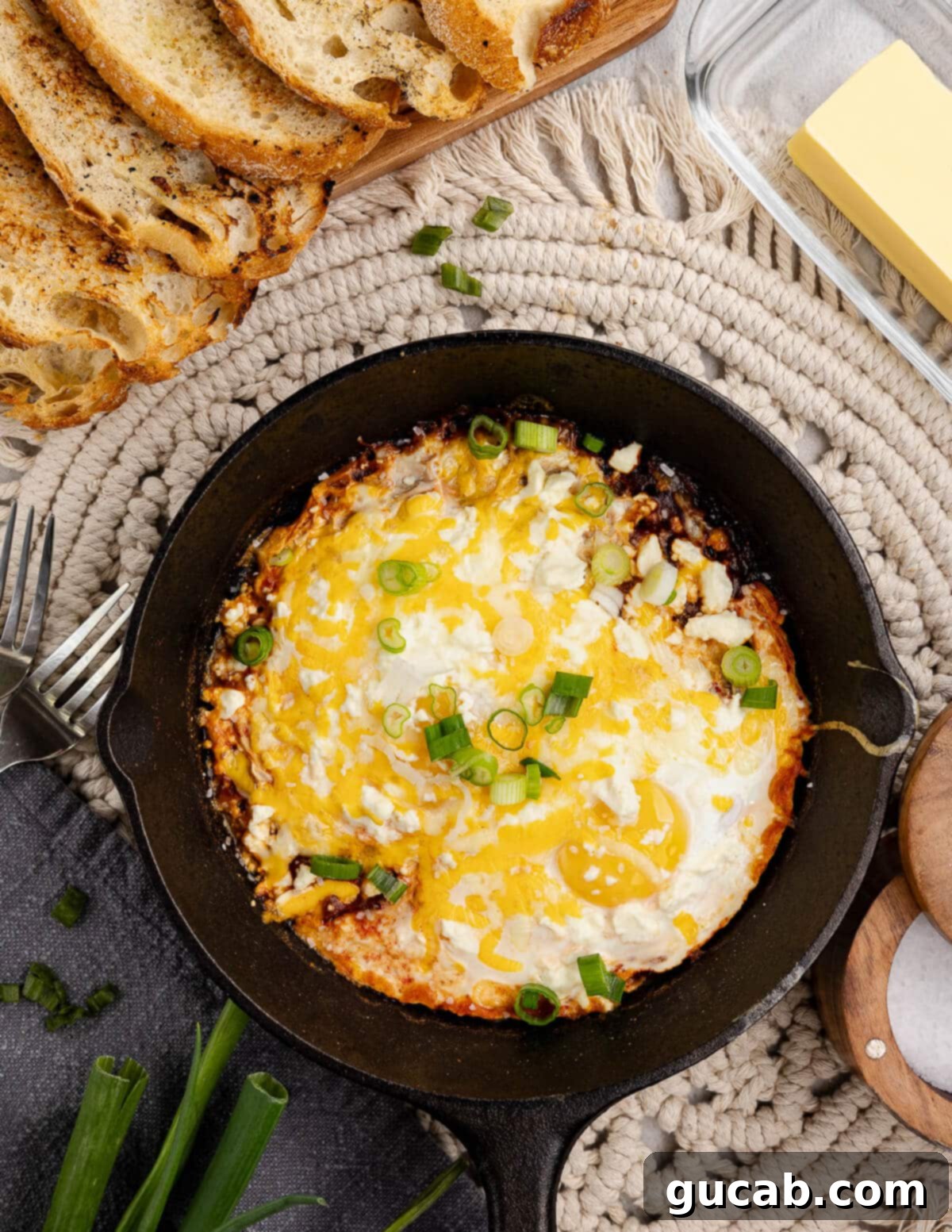 Eggs Fiesta: A Zesty Morning Kickstart 8 Perfectly baked salsa with eggs in a skillet, ready to be enjoyed.
