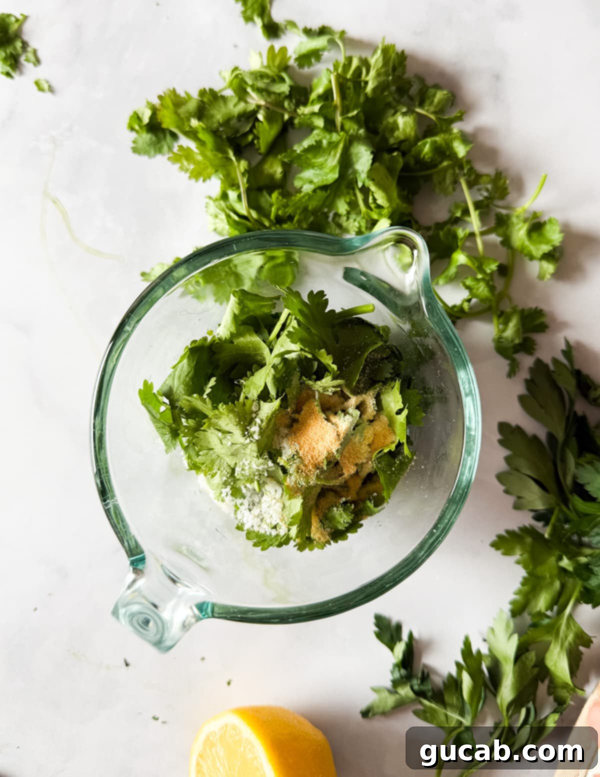 Herb-Crusted Roasted Cauliflower 4 Ingredients for herb roasted cauliflower being combined in a jar before blending.