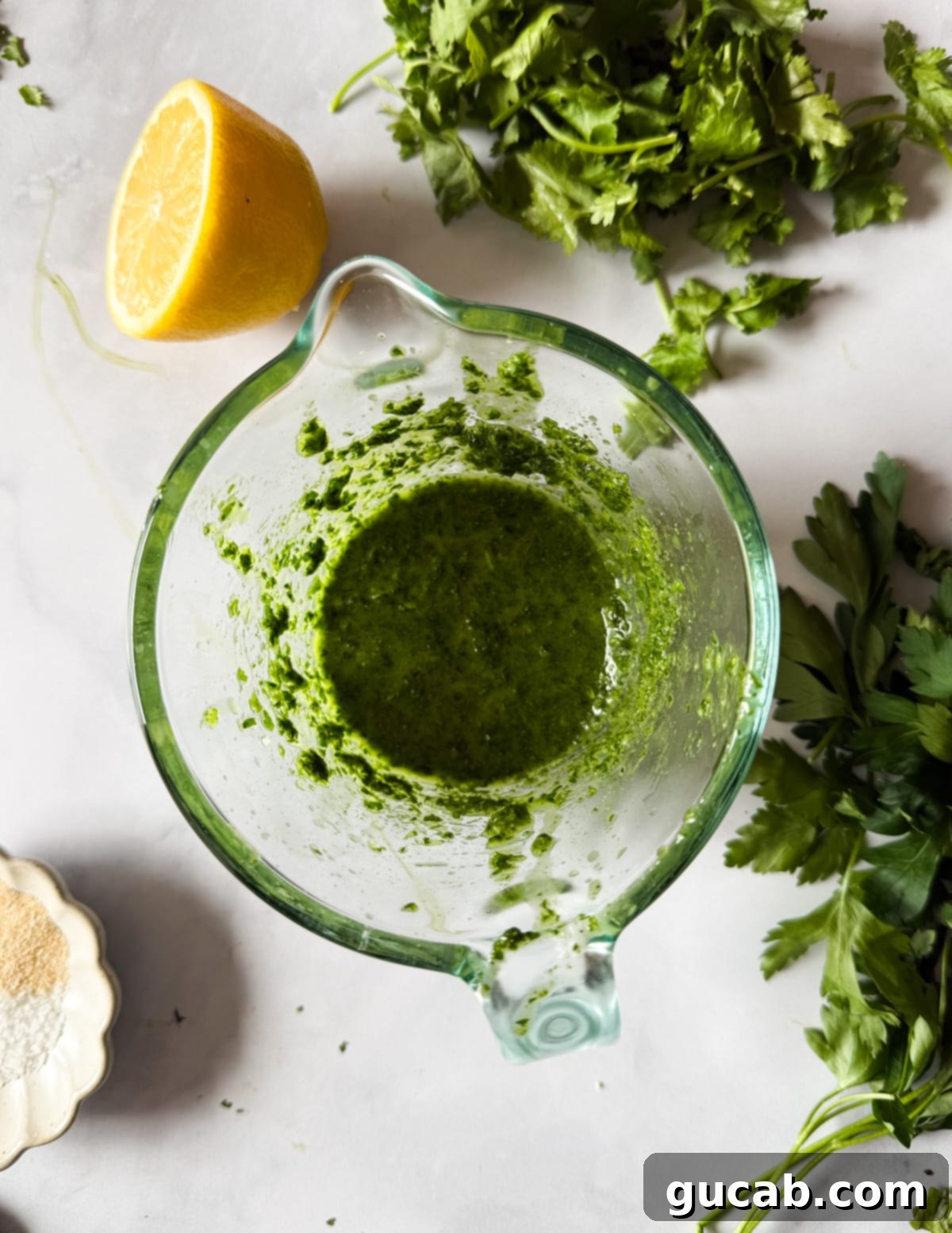 Herb-Crusted Roasted Cauliflower 5 Close-up of the herb olive oil after being blended, showcasing its vibrant green color.