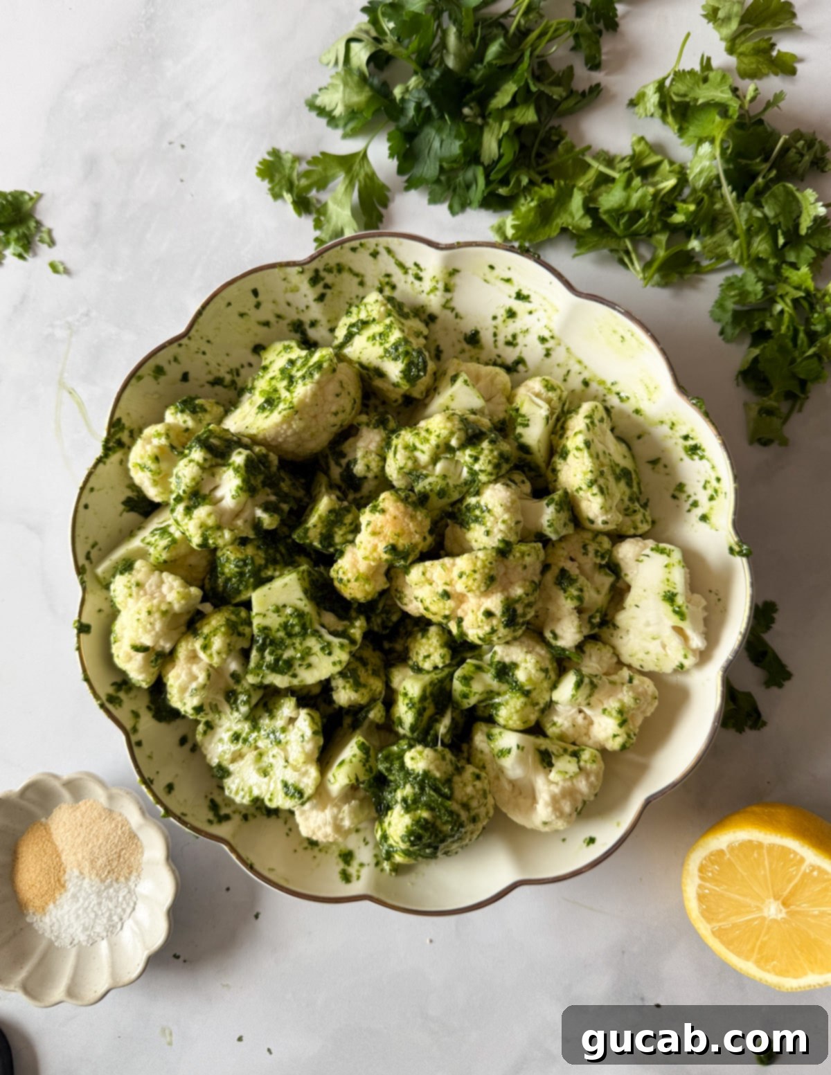 Herb-Crusted Roasted Cauliflower 7 Cauliflower florets tossed in herb oil, ready for roasting.